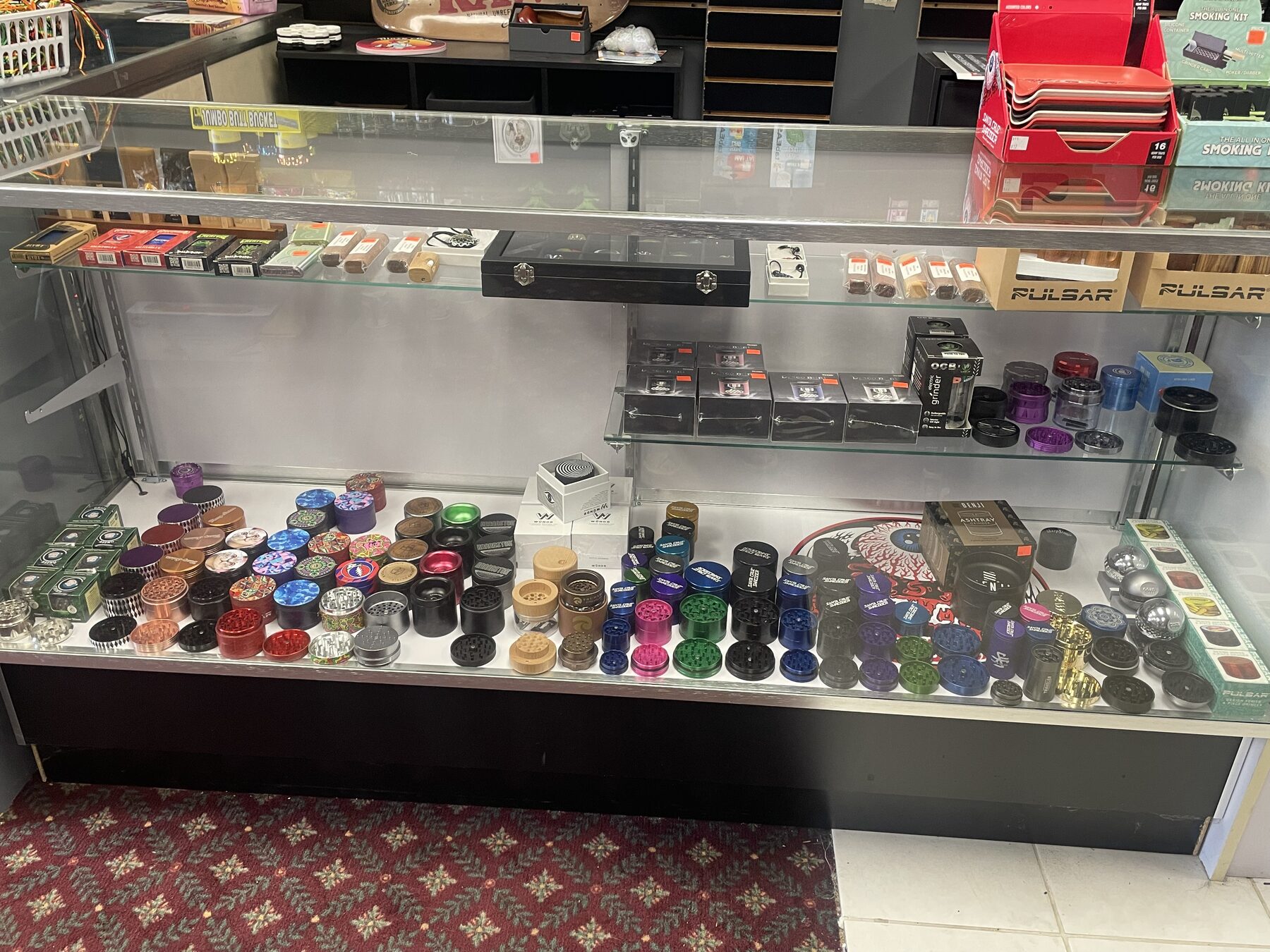 Small glass accessories organized inside a display case