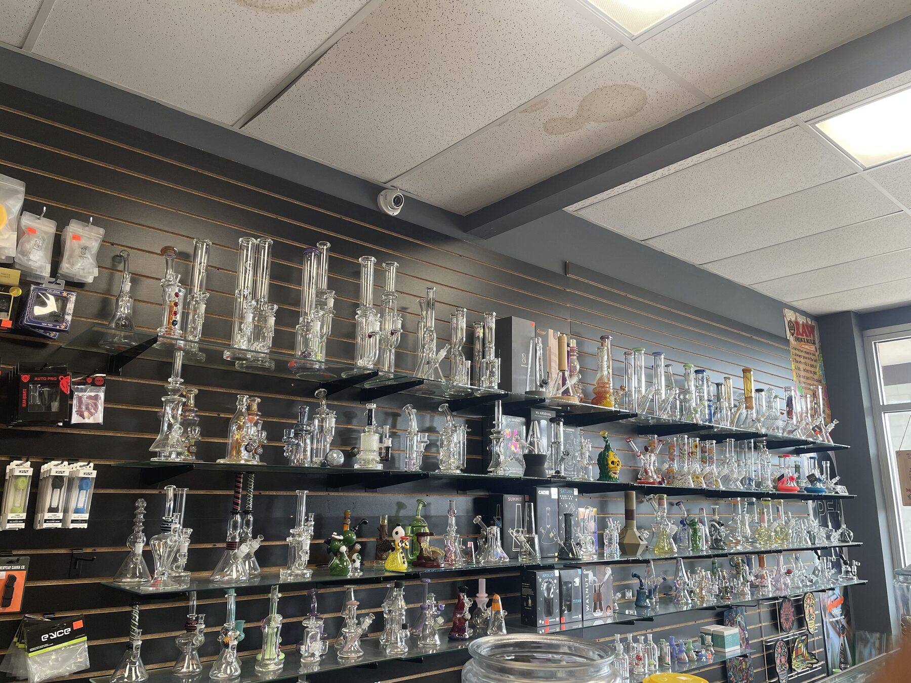 Wall of glass pieces displayed inside Germantown Vapor